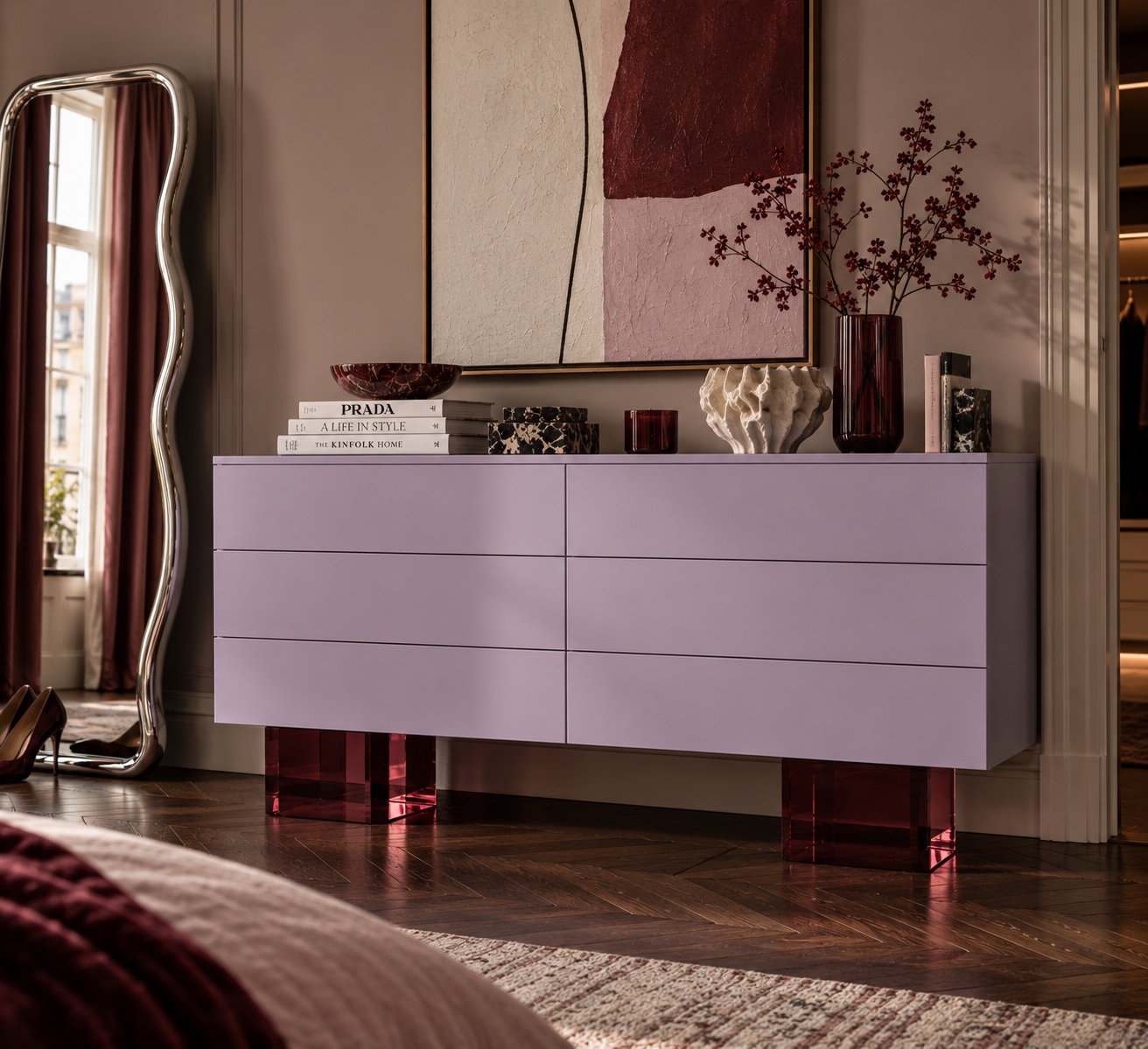 A pale lilac IKEA dresser lifted on translucent burgundy acrylic block legs